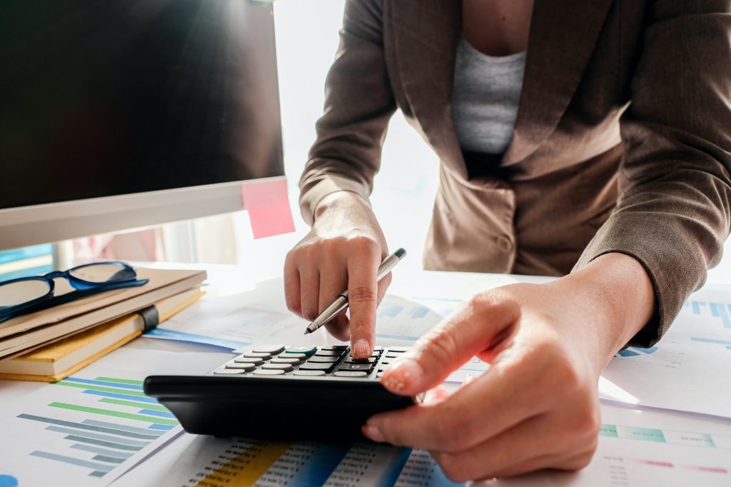 Businessman Accounting Counting with calculator and financial